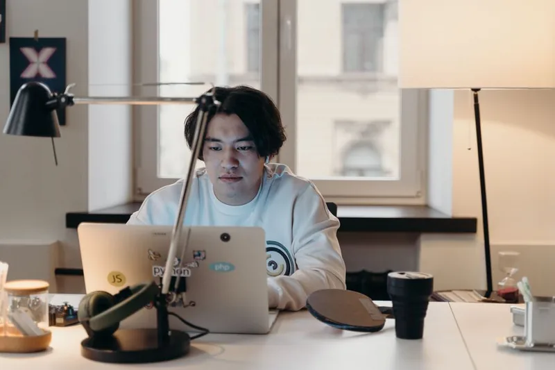 Developer working with headphones on